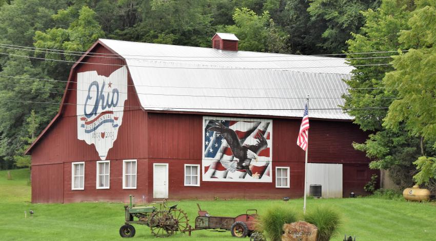 Large red barn with outline of Ohio and mural of an eagle