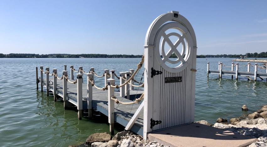 gated dock on edge of lake