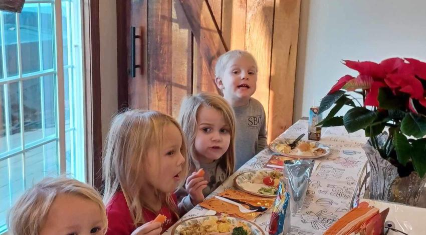 four children at table