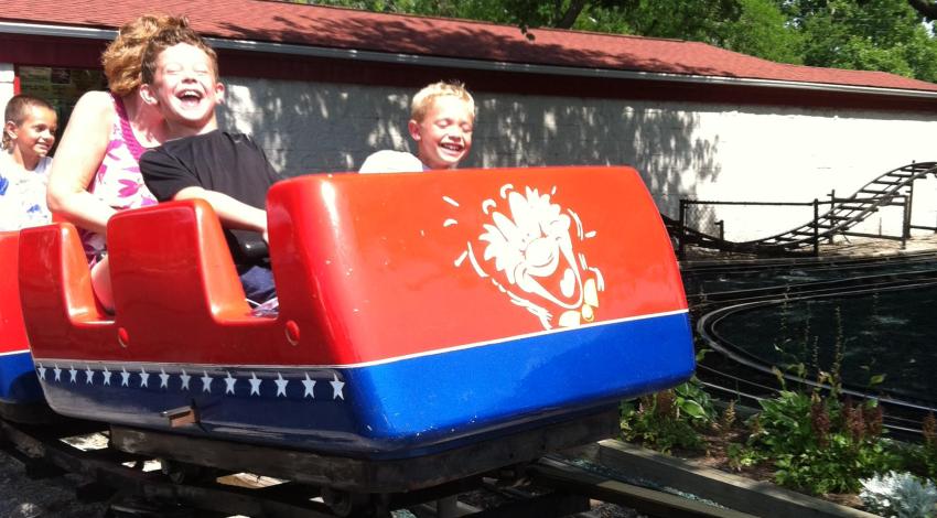 little boys on red roller coaster
