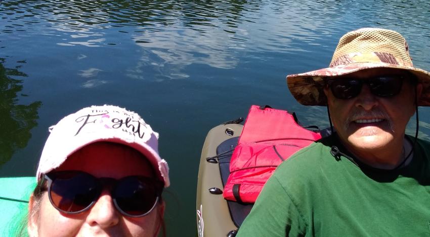 man and woman in kayak