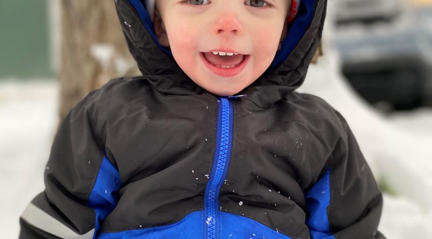 smiling child in snow