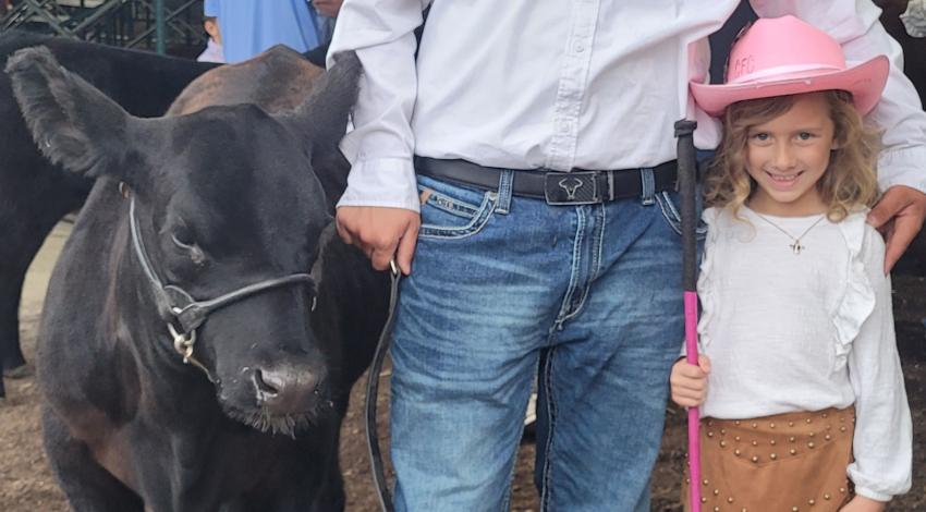 boy, girl, and cow
