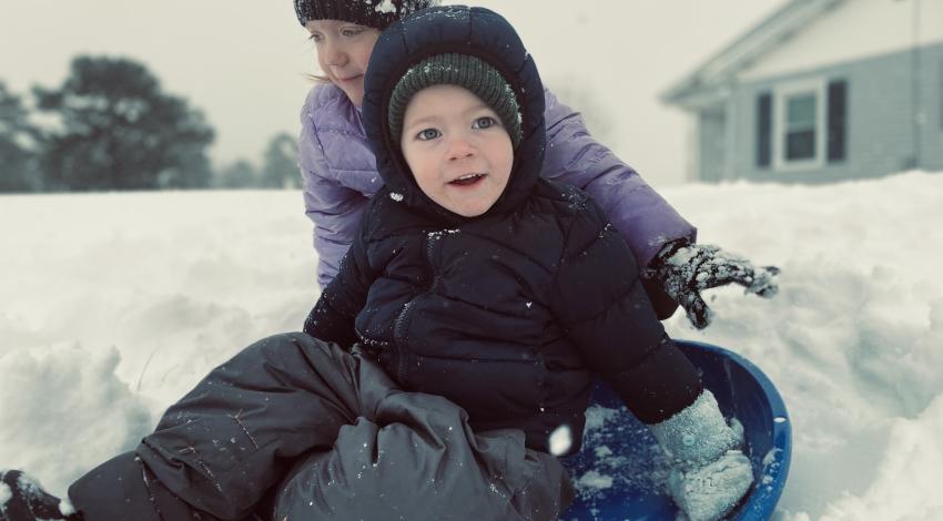 two children sledding