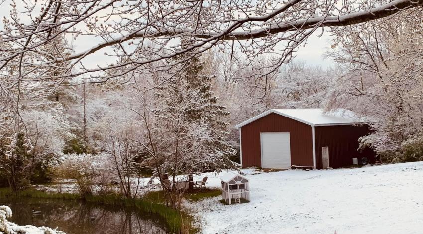 Red barn in snowy landscape