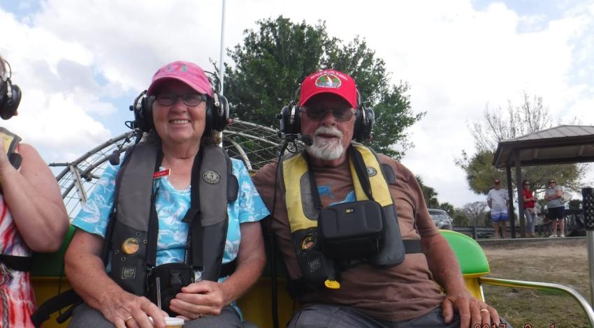 man and woman on airboat