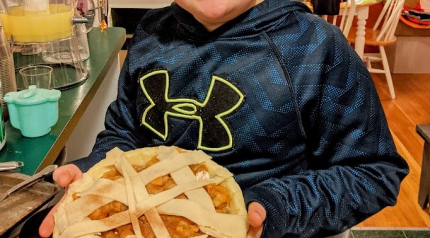 boy holding pie