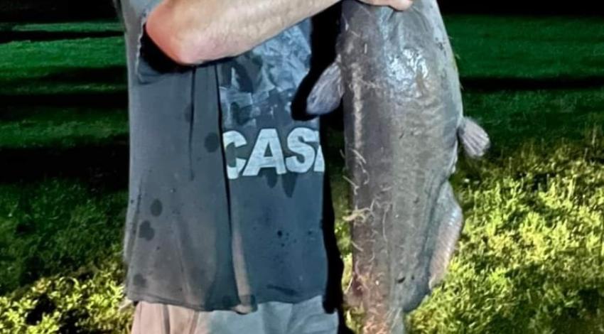 man holding big fish