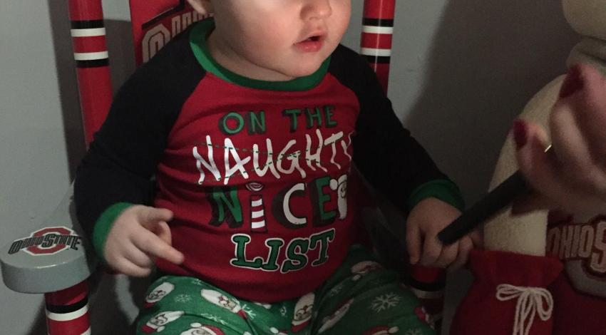 baby boy in Christmas pajamas