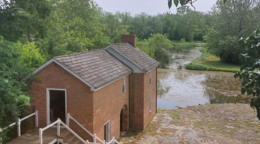 Small brown barn overlooking the canal