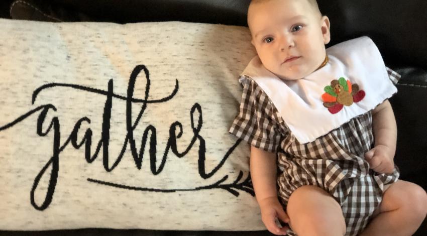 baby with turkey bib