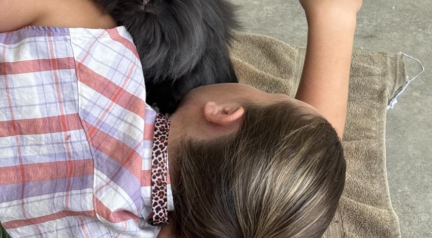 girl lying down with rabbit