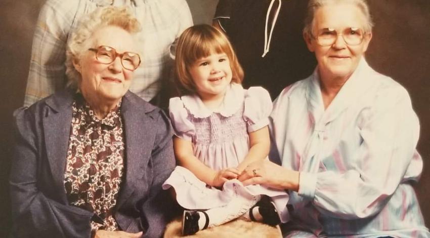 several generations of women/girls in studio photo