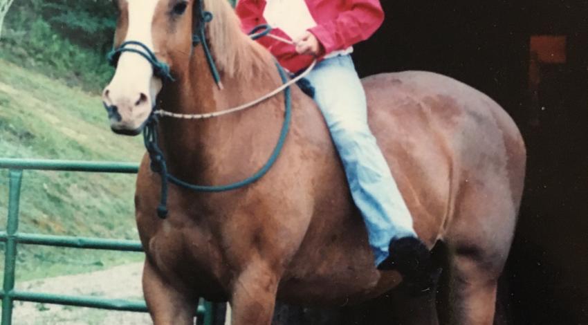 girl sitting bareback on horse