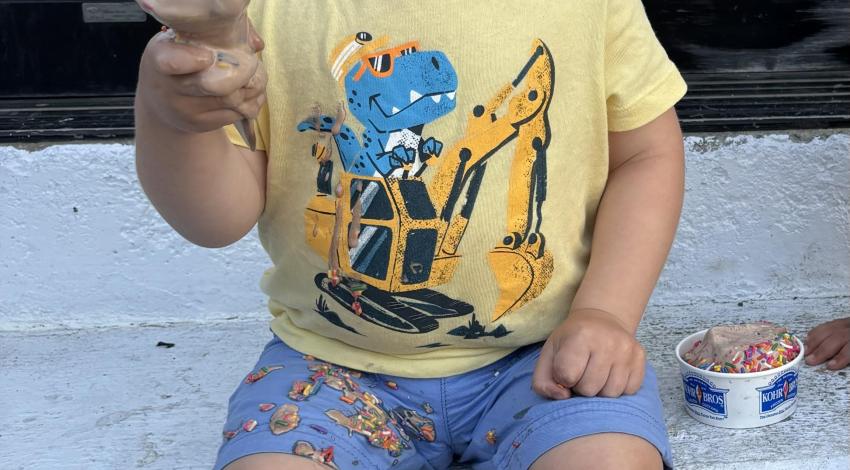 smiling little boy with ice cream cone