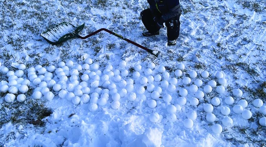 bundled up boy in snow