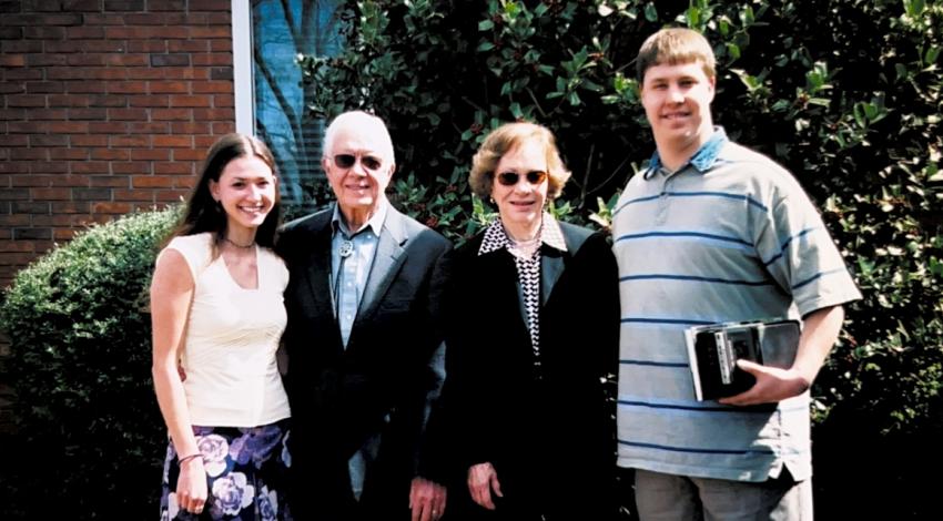 four people standing outside