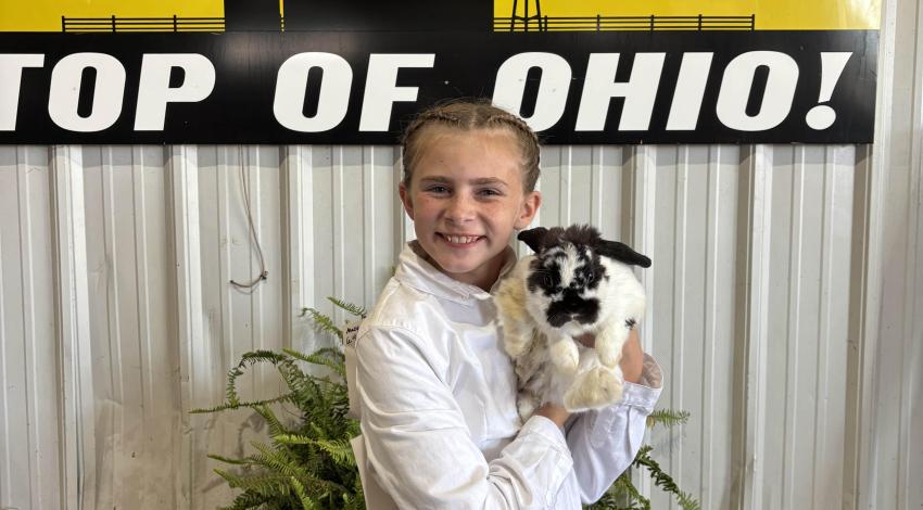 girl holding rabbit