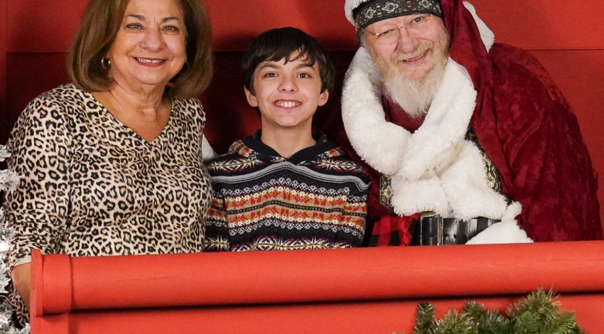 Woman, boy, and Santa Claus