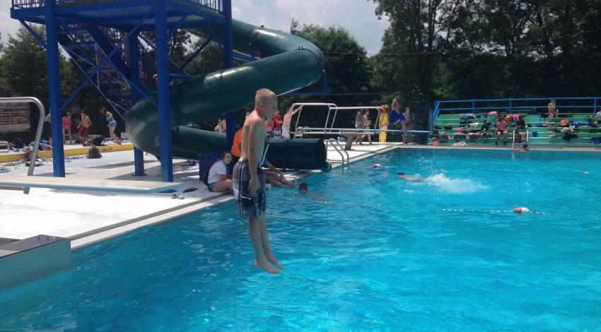 child jumps into pool