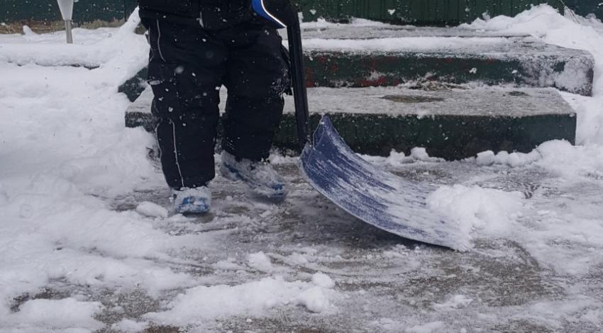 boy shoveling snow