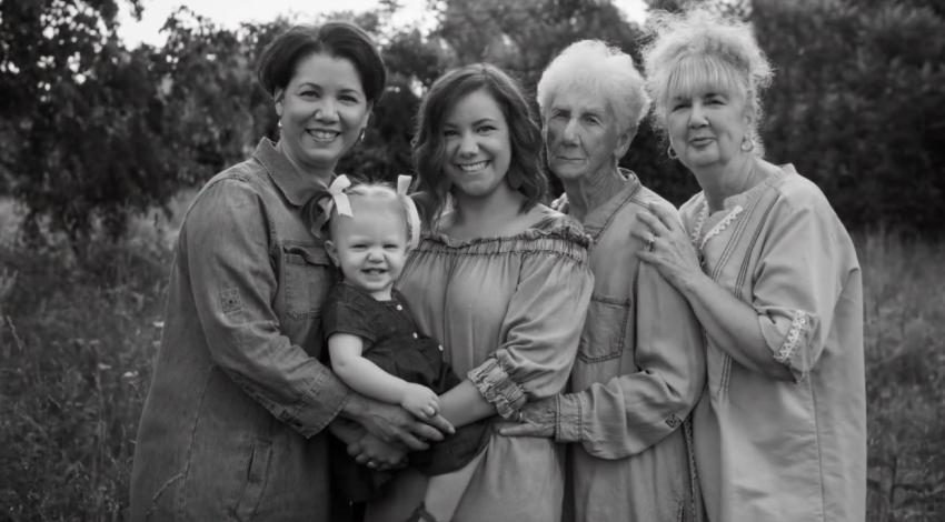 four women and a little girl outdoors