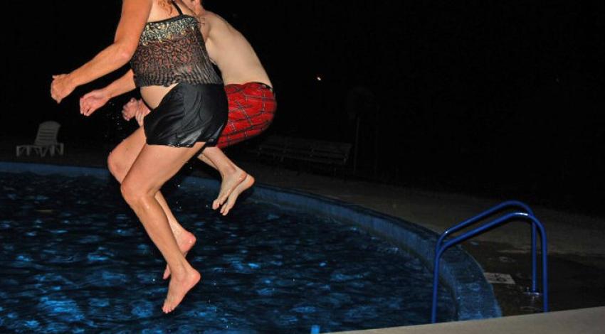 two people jump off diving board