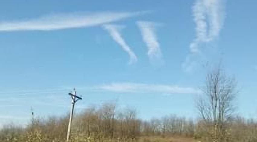 clouds form pi sign in sky