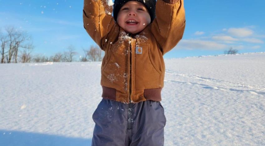 boy playing in snow