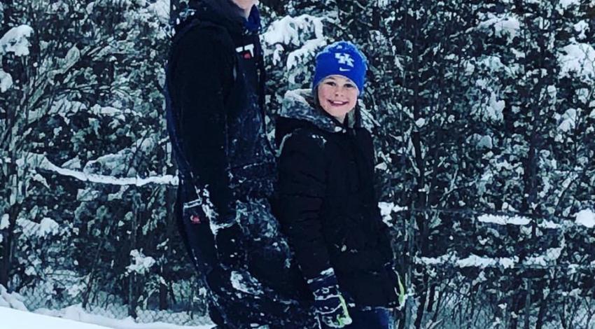 boy and girl walking in snow