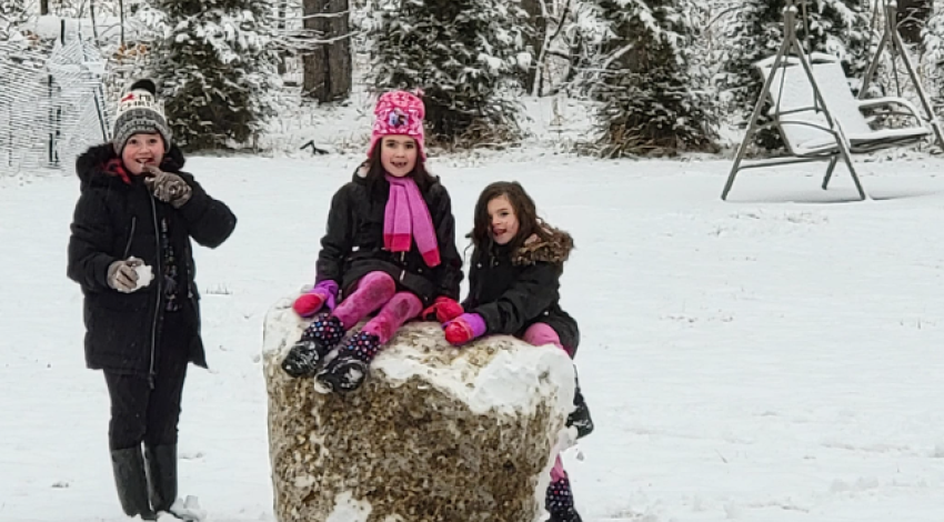 three kids with giant snowball