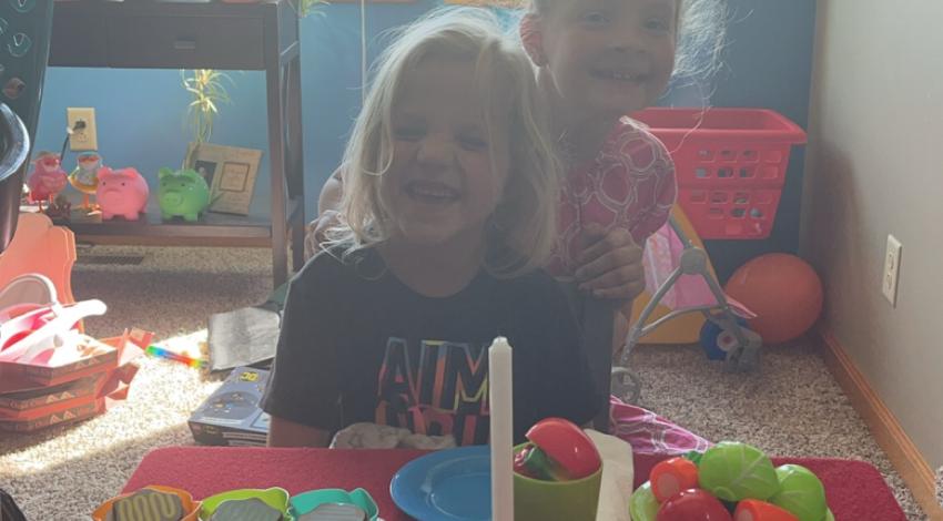 two little girls having tea party