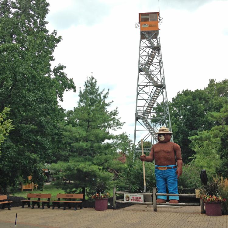 fire tower with Smokey Bear in front
