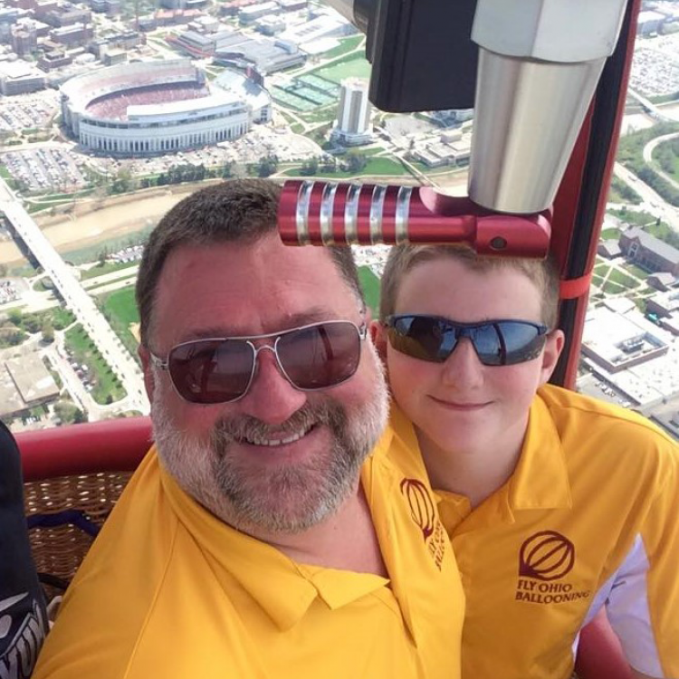 Bob Scobee and his son, Scott, flying high above the city of Columbus during a football game at the Ohio Stadium. Photo credit: Russ Jurg