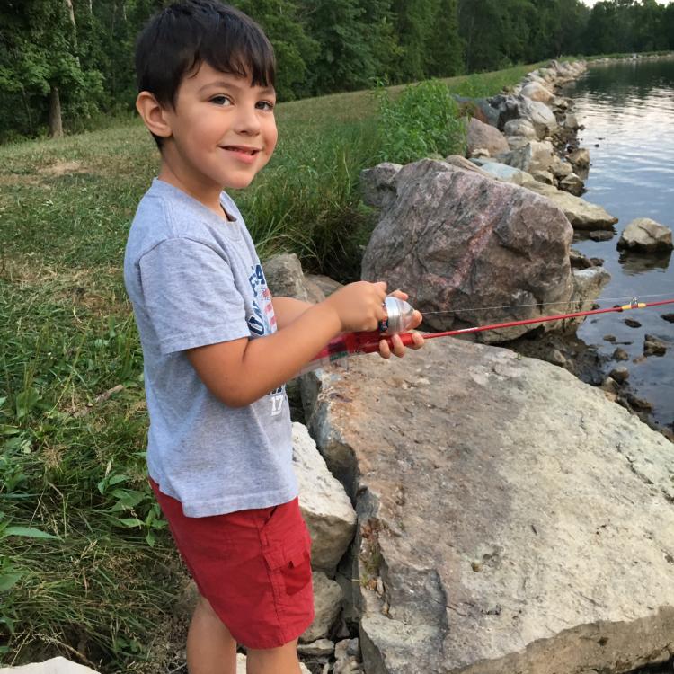 smiling boy fishing