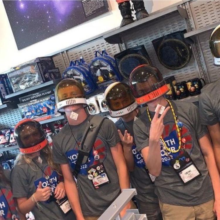 Six teenagers in space helmets and Youth Tour t-shirts