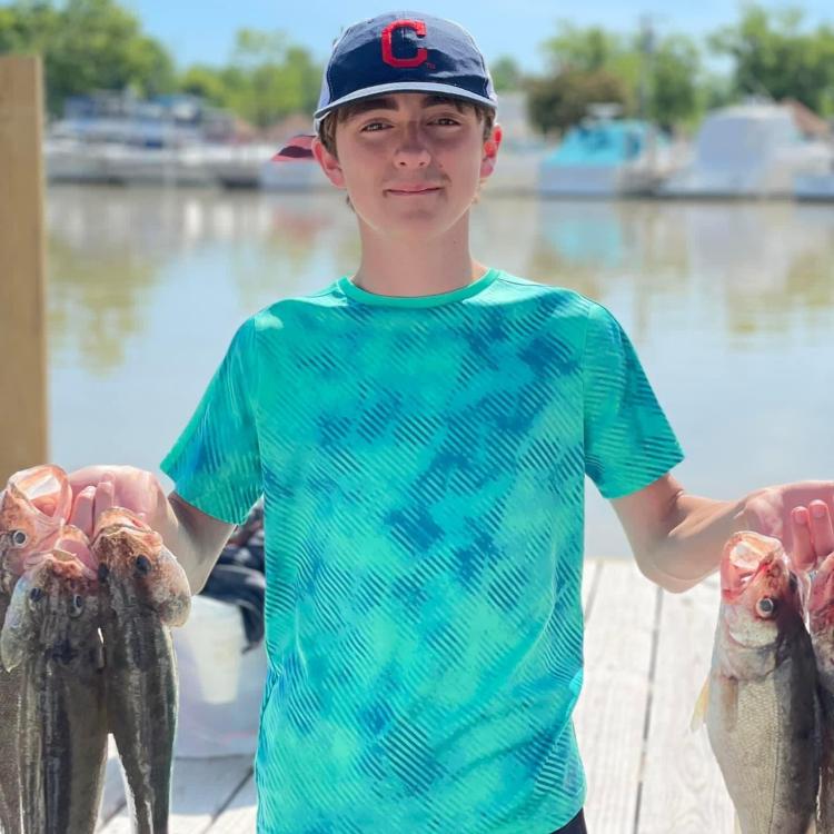 boy holding fish