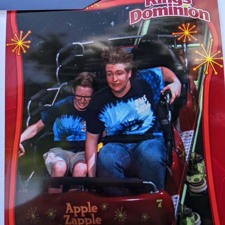 two people on roller coaster