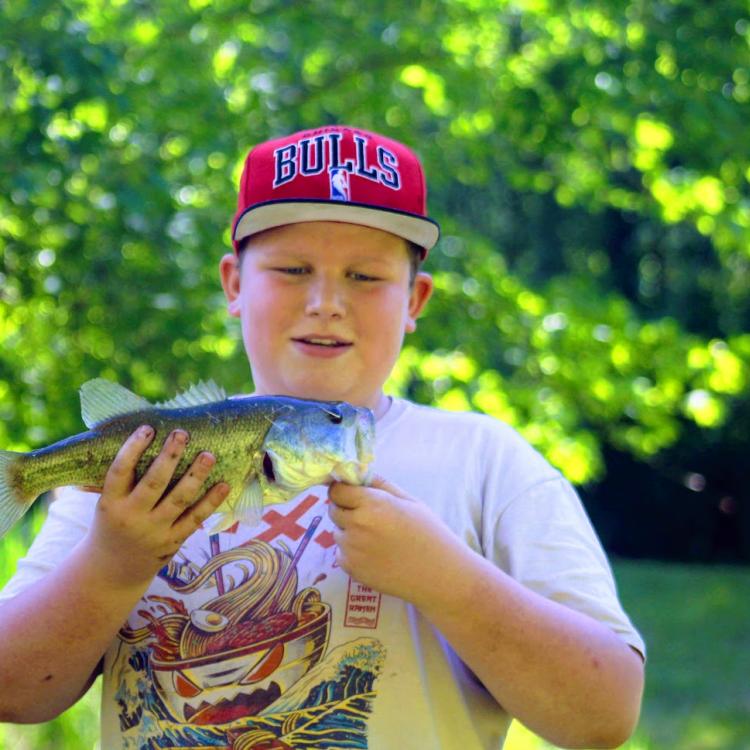 Boy holding a fish