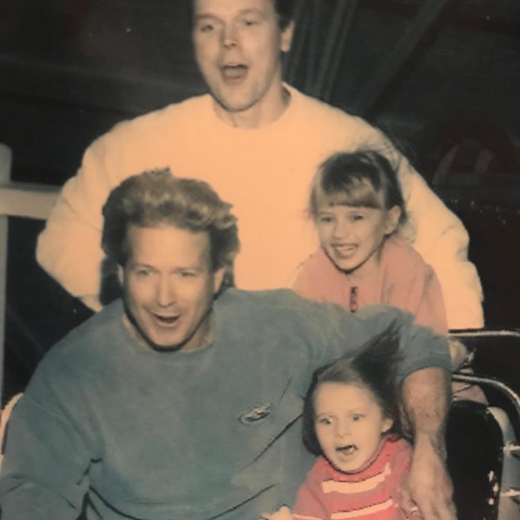 men and children on roller coaster