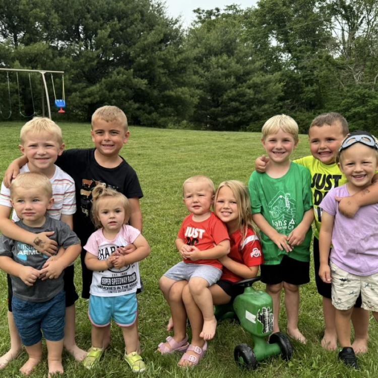 group of children on grass in yard