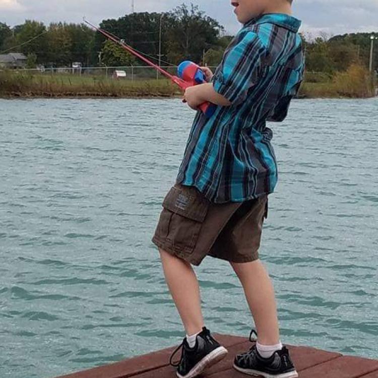 young boy fishing