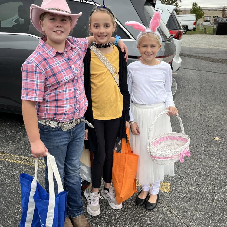 three girls dressed up for Halloween
