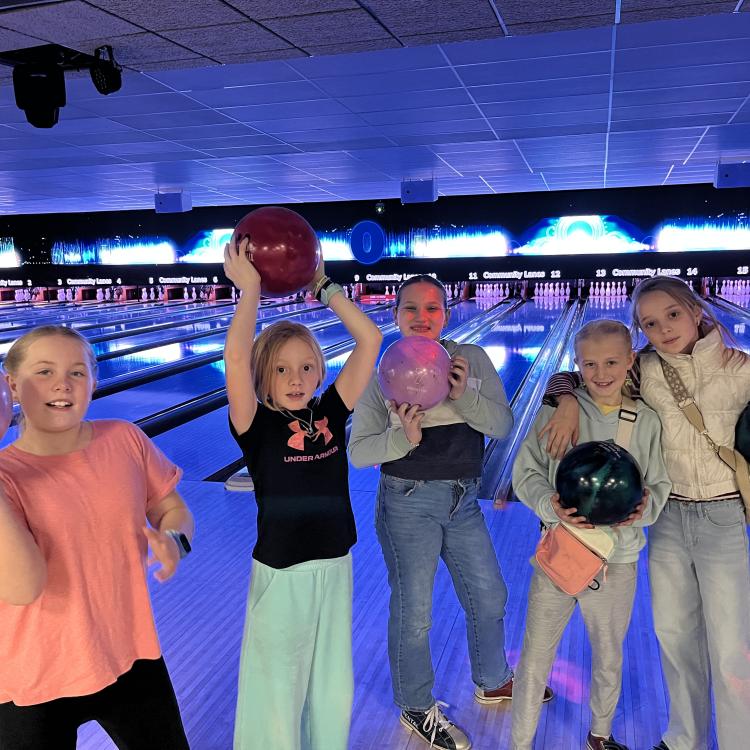 group of kids in bowling alley