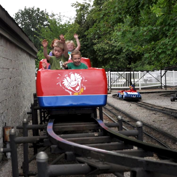 kids on red roller coaster