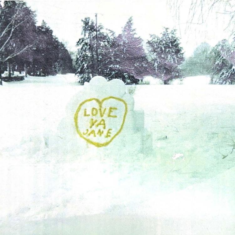 snow mound with a heart and Valentine's message