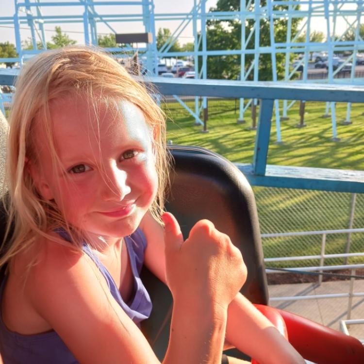 little girl on roller coaster