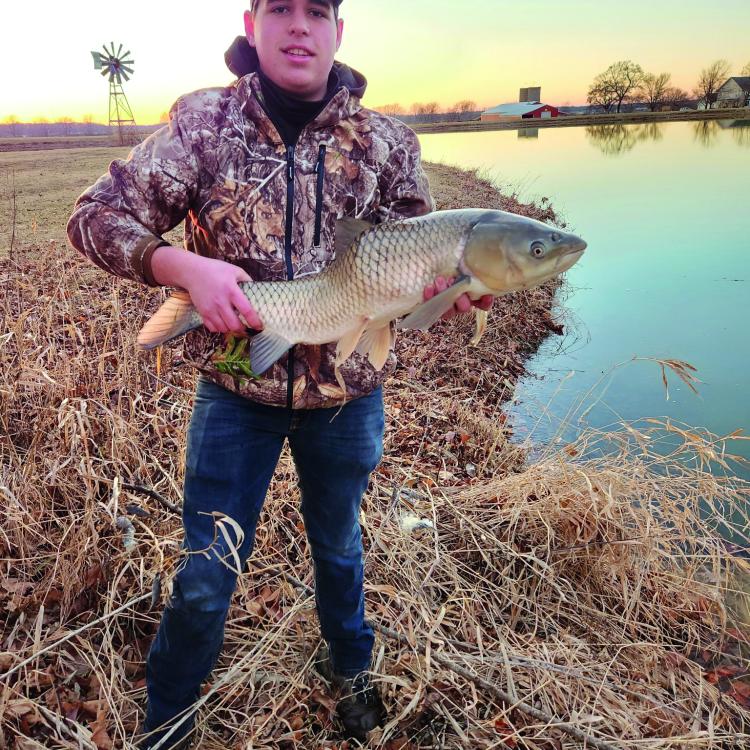 Boy holding a fish