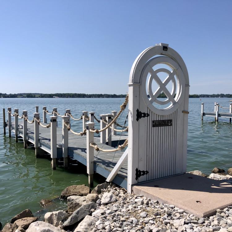 gated dock on edge of lake