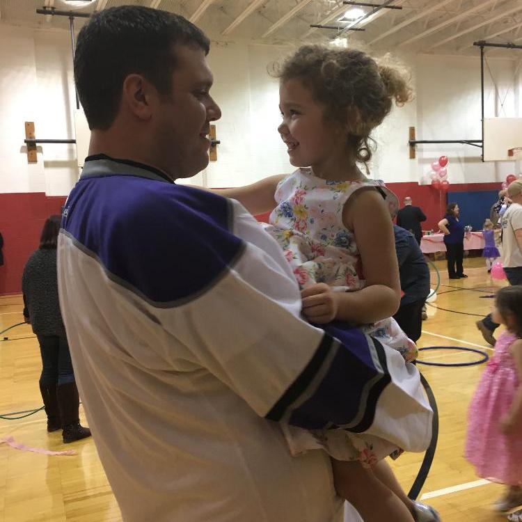 man holding small girl